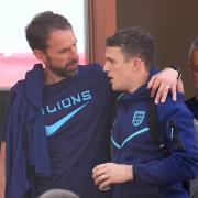 Newcastle United defender Kieran Trippier chats with Gareth Southgate at England's team hotel in Doha
