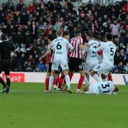 Both sets of players react angrily following the Luke O'Nien challenge on Ollie Cooper that resulted in the Sunderland defender receiving a straight red card