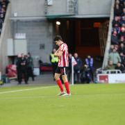 Luke O'Nien leaves the field following his dismissal against Swansea