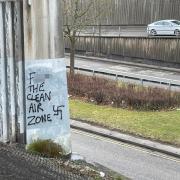 A Nazi symbol has been scrawled on a busy route into Newcastle city centre, in offensive graffiti attacking the new Clean Air Zone (CAZ) Credit: CONTRIBUTOR