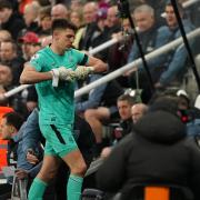 Nick Pope leaves the field after his dismissal against Liverpool