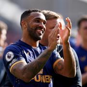 Callum Wilson applauds the travelling fans after Newcastle United's win at Brentford