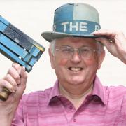 Bishop Auckland supporter Dick Longstaff, wearing a vintage bowler hat and waving a rattle. Dick has died, aged 83