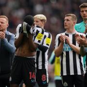 Newcastle's players show their disappointment after their 3-0 defeat to Aston Villa
