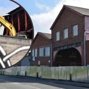 Bulldozers have moved in at the site of an historic bus depot which closed after 110 years last year.