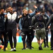 Newcastle's players and staff celebrate after their thrashing of Tottenham