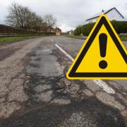 Drivers are warned to watch out for the potholes.