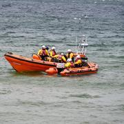 Crowds of people who had come to Redcar to see RNLI lifeboat volunteers carry out a demonstration rescue, as part of their Flag Day money raising efforts, found themselves watching the real thing this Saturday afternoon
