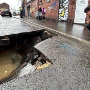 A huge sinkhole has suddenly appeared in the middle of a road leaving residents shocked.
