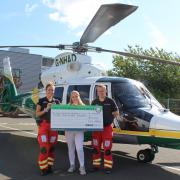 Tilly Raper with paramedic Jemma Kirby and Dr Mike Harrison.