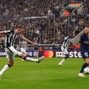 Sean Longstaff fires home his goal against Paris St Germain