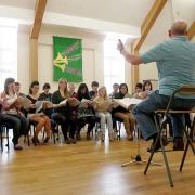 SING OUT: Director John Forsyth conducts the North-East Youth Choir.