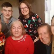 Carol Tate, 73, with her family during her last Christmas