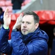 Michael Beale applauds the Sunderland fans at the Stadium of Light