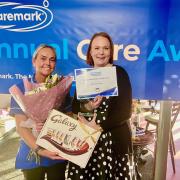 Caremark Redcar and Cleveland Carer of the Year Michelle Burr, left, is presented with her award