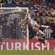 Dan Burn heads home in Newcastle's win over Paris St Germain