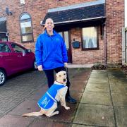 Caremark Redcar and Cleveland managing director Michelle Jackson with animal assisted Therapy dog Chance outside one of the supported living schemes in Guisborough