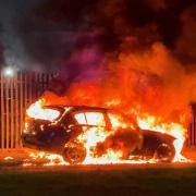 An appeal has been launched following a suspected arson targeting a BMW on Junction Road in Stockton last night Credit: TERRY BLACKBURN
