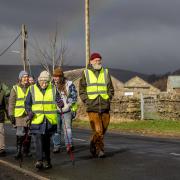 Ninety-eight-year-old Dr Margaret Bradshaw (centre) has completed a 55-mile trek.