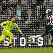 Alexander Isak heads home Newcastle's opening goal