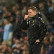 Eddie Howe watches on through the rain during Newcastle's 2-0 defeat at Man City