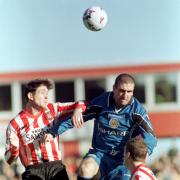 Sunderland defender Richard Ord (left) clashes in mid-air with Manchester United's striker Eric Cantona at Roker Park.