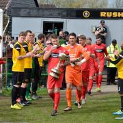 Darlington captain Kevin Burgess leads Darlington on to the pitch at Rushall Olympic in April 2016