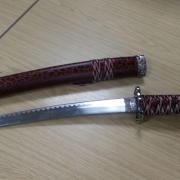 A County Durham man has pleaded guilty to threatening housing officers with a samurai sword at his home