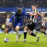 Elliot Anderson battles for the ball with Chelsea's Conor Gallagher