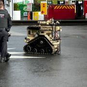 A robot pictured at the scene earlier on Wednesday afternoon.