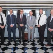 From left, Commodore Paul Pitcher, UK Docks MD Jonathan Wilson, Graeme Little, deputy director Future Support Acquisition, Harry Wilson UK Docks founder, Commodore Steve Large and Neil Dando of the Hydrographic & Patrol Delivery Team aboard HMS Victory