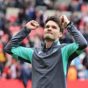 Danny Rohl celebrates Sheffield Wednesday's survival at the Stadium of Light
