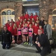 Allerton Junior Athletics Club  with Head coach Glen Hilton is in the foreground on left with the Mayor of Northallerton, Phil Eames, on the right in front of Councillors Julie and Colin Hutson, who are sponsors of the club
