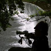 Bugler Lance Corporal Angie Sowerby plays the last post at the falls where the DLI soliders lost thir lives on a training exercise at the River Coquet near Guyzance in Northumberland. Angie is from Middridge Village and is now stationed at Deepcut.