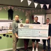 Darlington Round Table chairman Alex Taylor-Garthwaite (left) and members Daniel Flynn and Daniel Reed present £1,000 to Angela Tovey, president of Middleton St George WI
