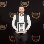 Michael England, who named Millie Moo's after his daughter, with his award.