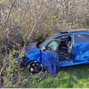 Audi ends in bushes after morning rush-hour police chase