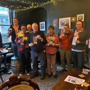 CAMRA members and Ripon BID manager Lilla Bathurst with the new Ripon Real Ale Guide