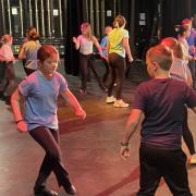 Children from Star of the Sea Catholic Primary in Whitley Bay doing an ABBA‑inspired routine at the Playhouse