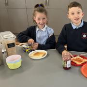 Families now have greater access to wraparound childcare provision before and after the school day. Pictured are pupils from Boroughbridge Primary School enjoying their breakfast.