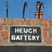 Sign marking Heugh Battery, the historic Hartlepool site where British guns fired back during a First World War attack.