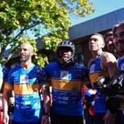 Sir Kevin Sinfield, third right, was joined by Micah Richards, third left, as he completed day four of his final ultra marathon challenge (Annabel Lee Ellis/PA)