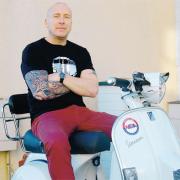 HELPING PEOPLE: Neil Williamson his scooter