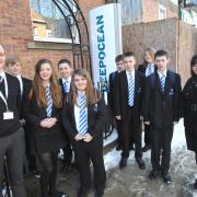 Tom Nightingale and Katie Johnson greet Longfield School pupils as they arrive at DeepOcean for their visit. Picture: Doug Moody