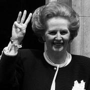 Prime Minister Margaret Thatcher giving a three-fingered salute outside 10 Downing Street as she begins her third successive term of office