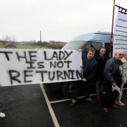People unfurl banners as they arrive at Easington Colliery Social Club for a party on the day of Margaret Thatcher's funeral - although which some insisted marked not her death, but the 20th anniversary of Easington Colliery's closure