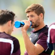 THIRSTY WORK: England captain Steven Gerrard stops to have a drink during a training session ahead of tonight's World Cup opener against Italy Picture: MIKE EGERTON/PA