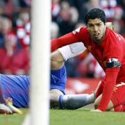 Luis Suarez, right, and Chelsea's Branislav Ivanovic on the ground after Suarez bit Ivanovic during the Barclays Premier League match at Anfield, Liverpool, in April last year