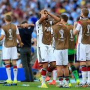 AGONY WATCHING: Germany midfielder Sami Khedira, centre, was ruled out of the World Cup final after sustaining an injury during his team's warm-up