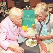 June Whitfield and Moira Kelly, aged 81, with her digital device during the EE Techy Tea Party